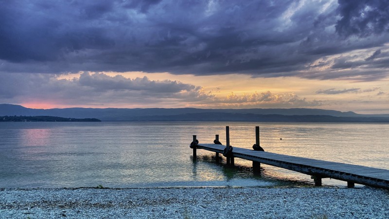 Pontoon under a heavy black sky
