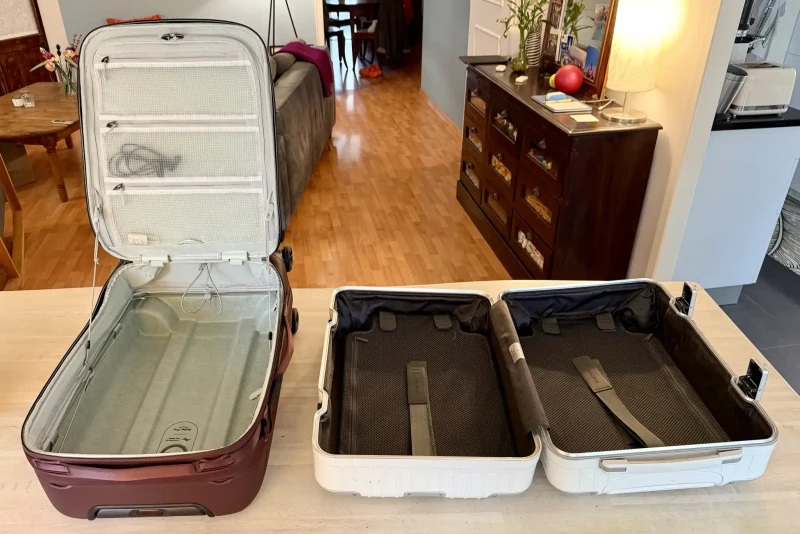 Both suitcases opened flat on the table