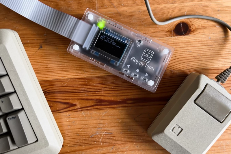 A close-up of the floppy emu connected to my Mac Plus with the original mouse on the right